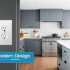 Modern kitchen cabinet and appliances featuring gray cabinetry, light countertops, and a white electrical switch plate.