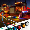 Round LED side marker lights for trucks and trailers displayed on a dark road at night.