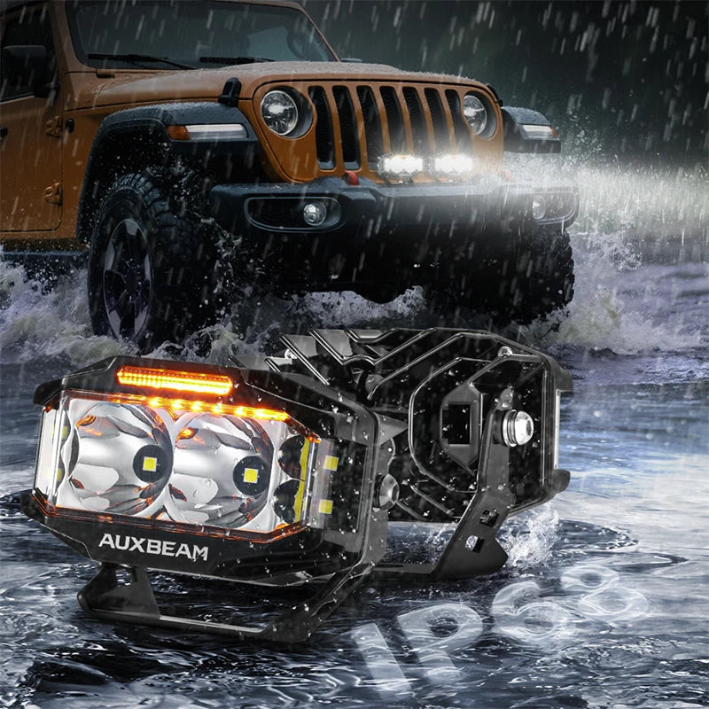 A rugged Jeep is shown in a rainy environment with an AUXBEAM high-performance LED driving light mounted on the ground.
