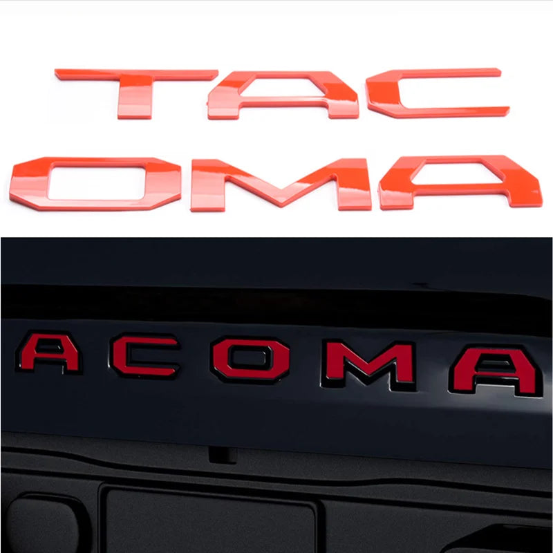 Orange 3D letter cover emblems for a Toyota Tacoma tailgate