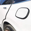Close-up of a black rubber edge seal trim installed on the door frame of a white vehicle.
