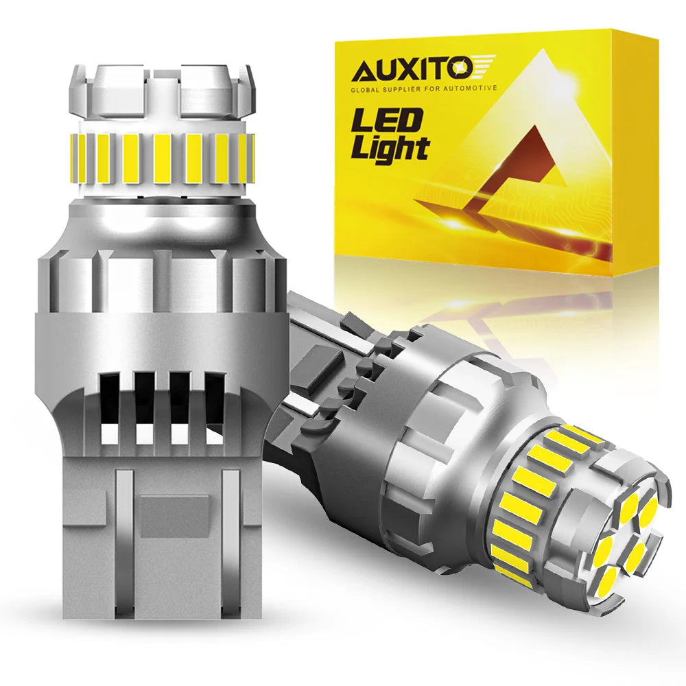 A silver LED light bulb assembly with a yellow accent, shown next to its packaging box.