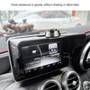 A black car GPS navigator is mounted on a dashboard, showing a display and an adjustable visor.