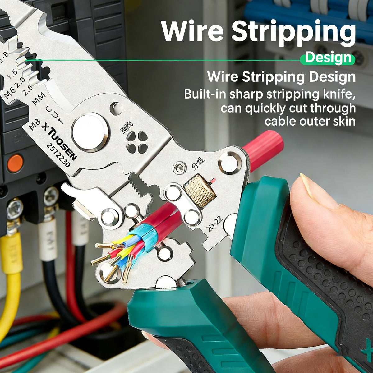A hand is using a wire stripping design tool to strip insulation from a red cable.