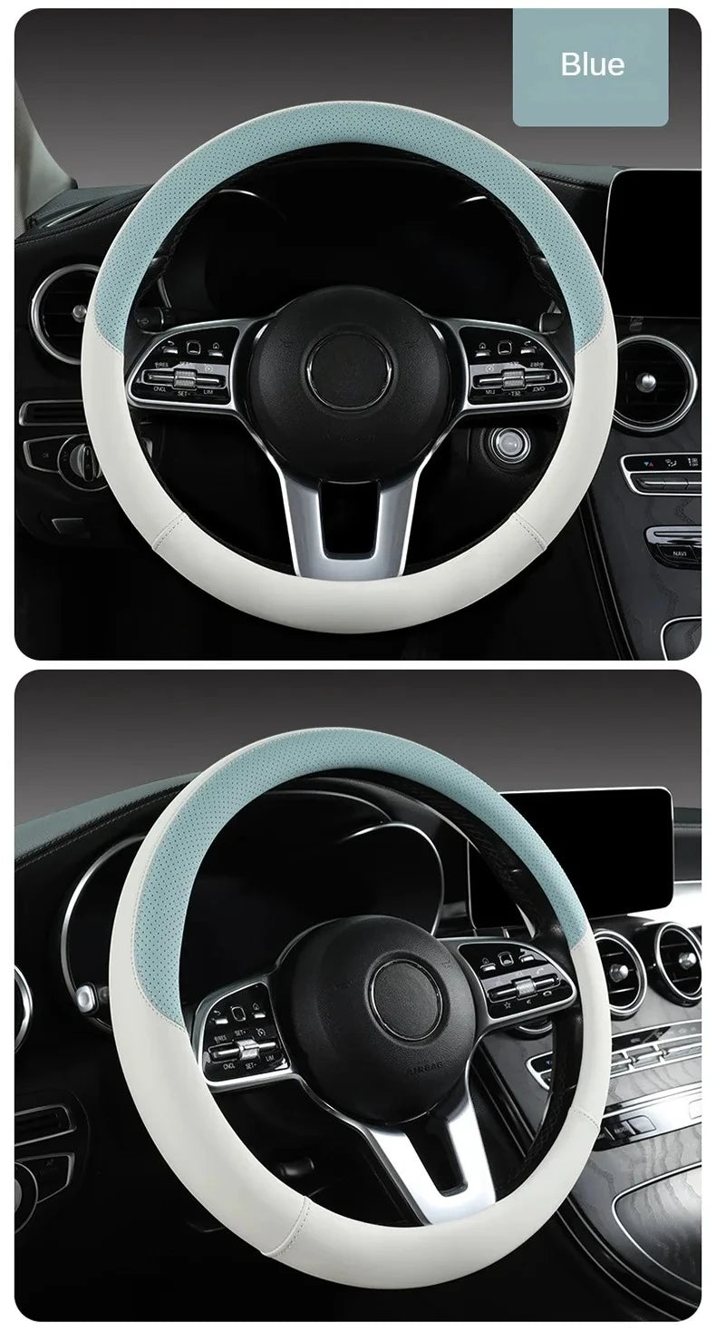 Close-up view of a blue perforated Nappa leather steering wheel cover in a car interior.