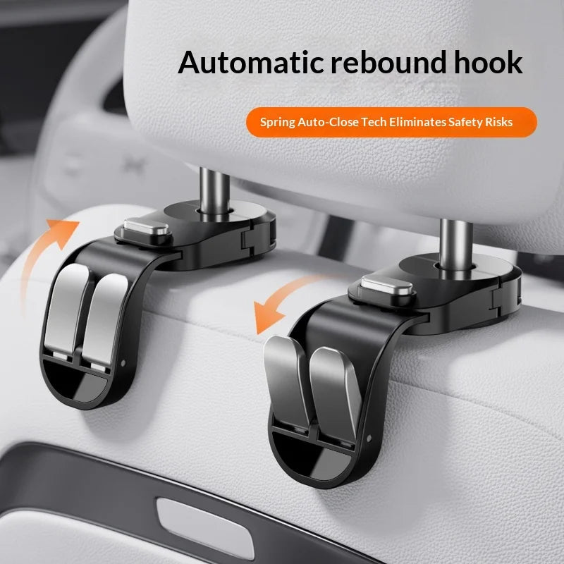 Close-up of an automatic rebound hook mechanism for a car seat back organizer, showing the spring auto-close technology.