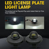 Two LED license plate light lamps shown on a dark surface, highlighting the bright light output.