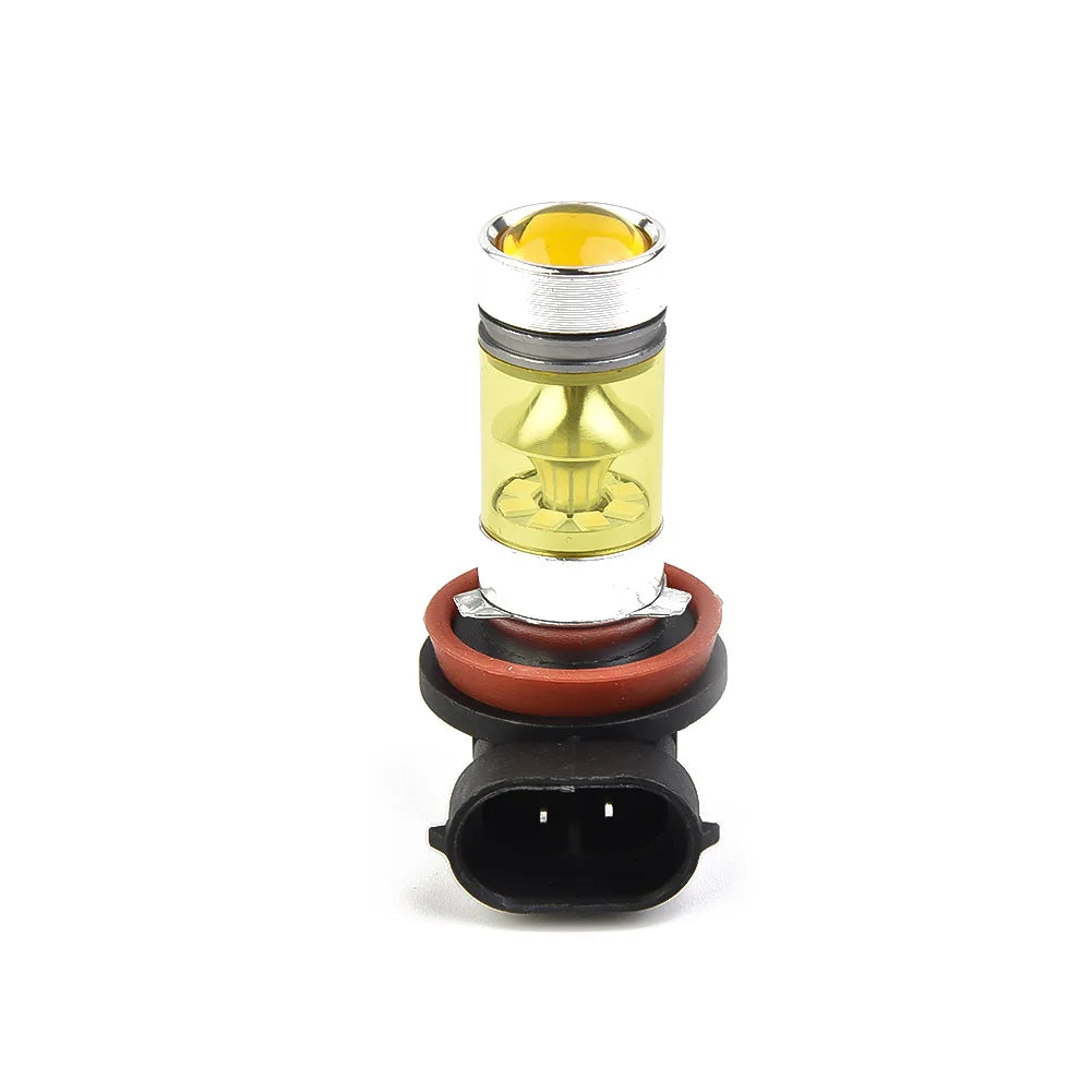 A yellow LED fog light bulb with a silver and gold housing and black connector.