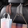 Black leather car seat headrest hooks with brown and gray leather straps for vehicle organization