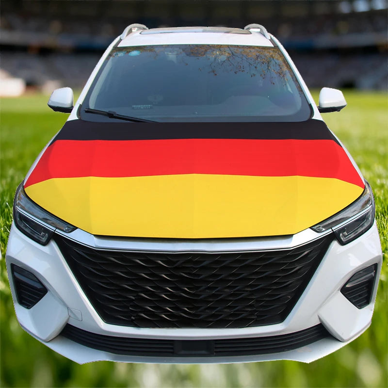 A white car hood decorated with the German flag design on the hood.