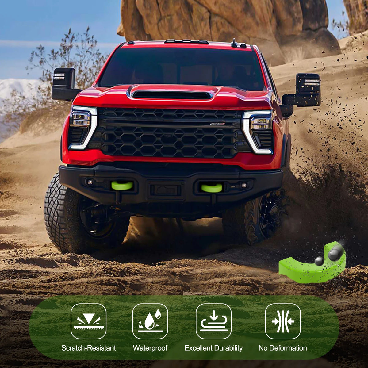 A red Ford F-150 truck with silicone tow hitch covers installed in a desert environment.