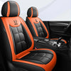 Black and orange universal PU leather car seat covers shown in a vehicle interior.