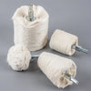 A spool of light beige polishing wheel with a metal shank, used for jewelry and metalwork.