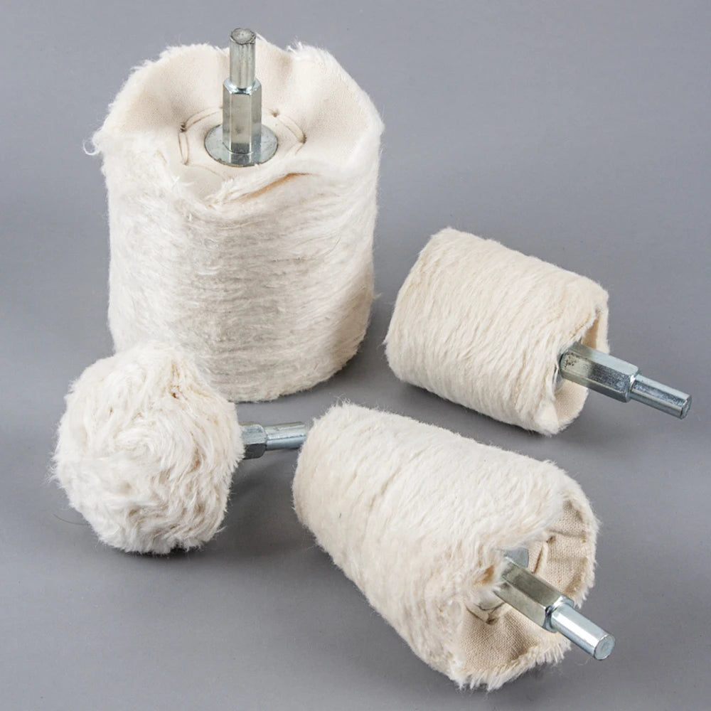 A spool of light beige polishing wheel with a metal shank, used for jewelry and metalwork.