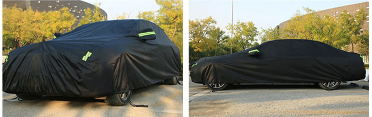 A black all-weather waterproof UV car cover is shown covering a vehicle outdoors.