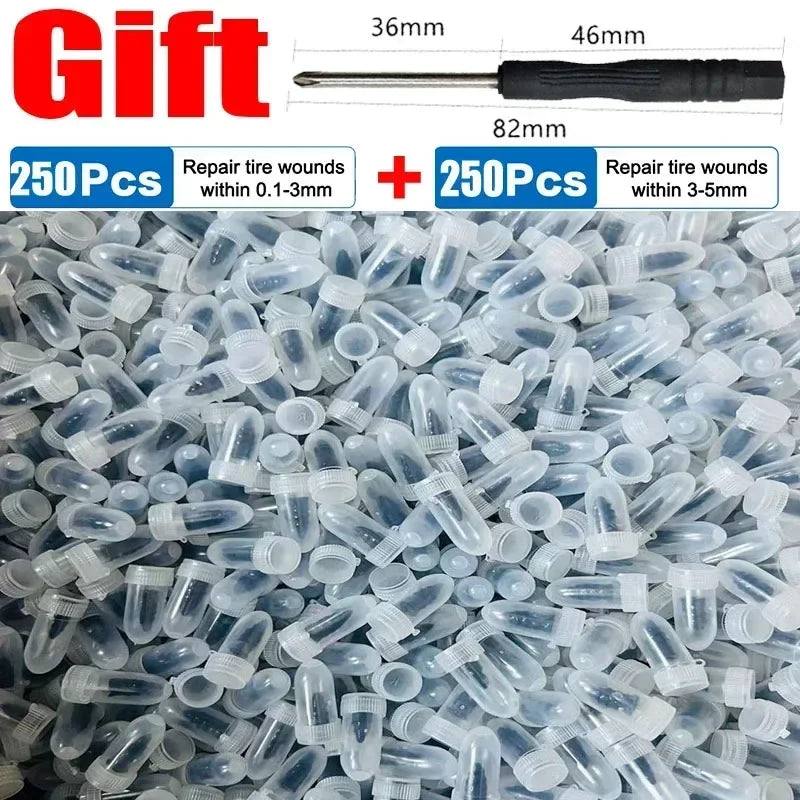 Une pile de clous pour réparer des pneus en plastique transparent et un outil de mesure montrant la longueur des clous.