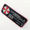 A black and red umbrella decal with a white honeycomb design and the text Umbrella Corporation Hive Parking Level 3