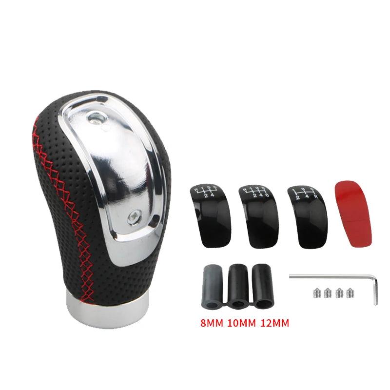 A silver manual gear shift knob with interchangeable black and red speed covers and various sized metal pins.
