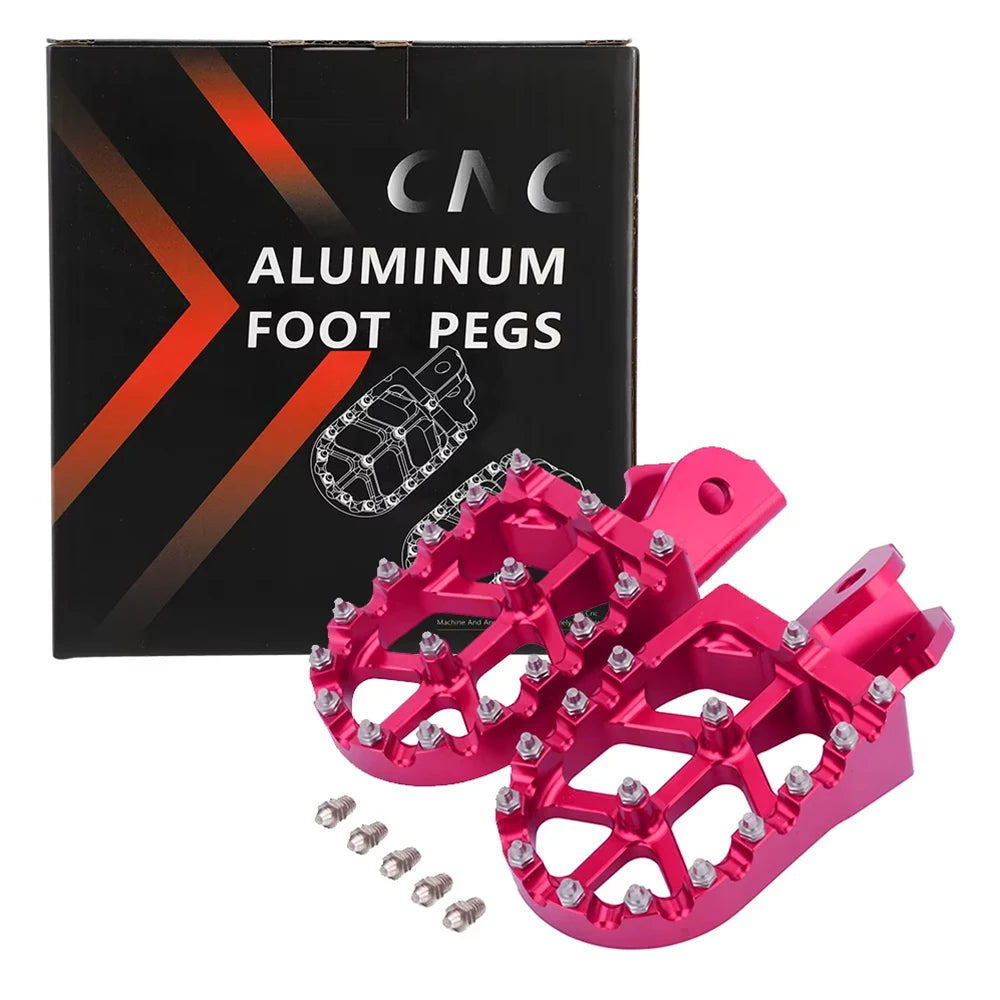 A box and set of bright pink aluminum foot pegs for motorcycles.