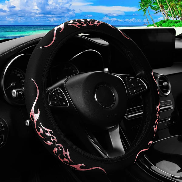 Black steering wheel cover with a dynamic flame pattern on the rim inside a car interior.