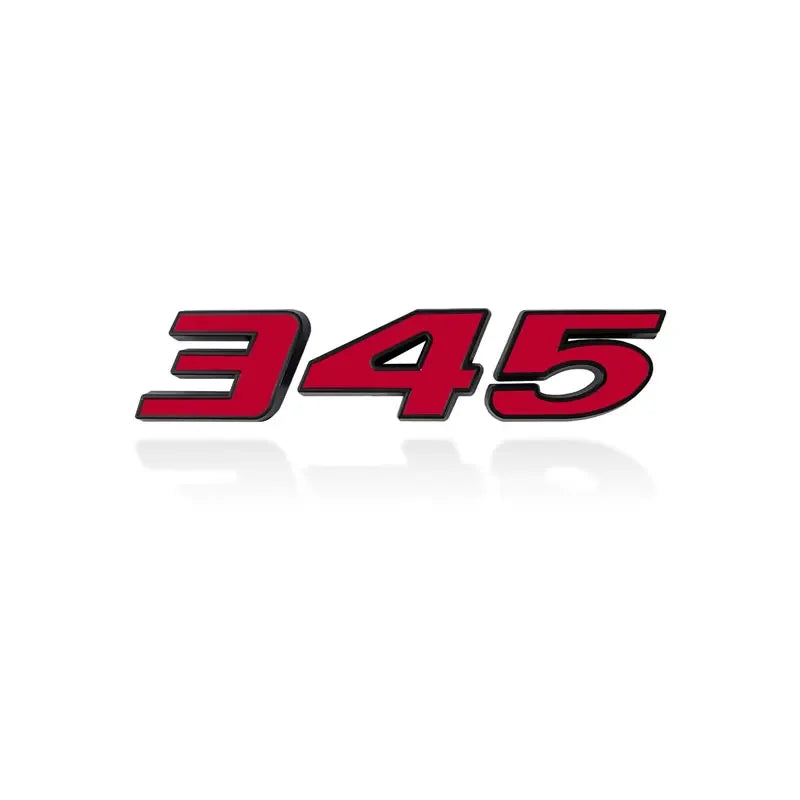 A close-up view of a red and black 3D metal car fender side and trunk decal.