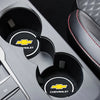 Close-up view of a Chevrolet branded car anti-slip coaster set in a silver holder.