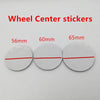 Three round white stickers marked with diameters of 56mm, 60mm, and 65mm for car wheel center caps