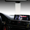 A parking permit holder and protector mounted on a car dashboard.