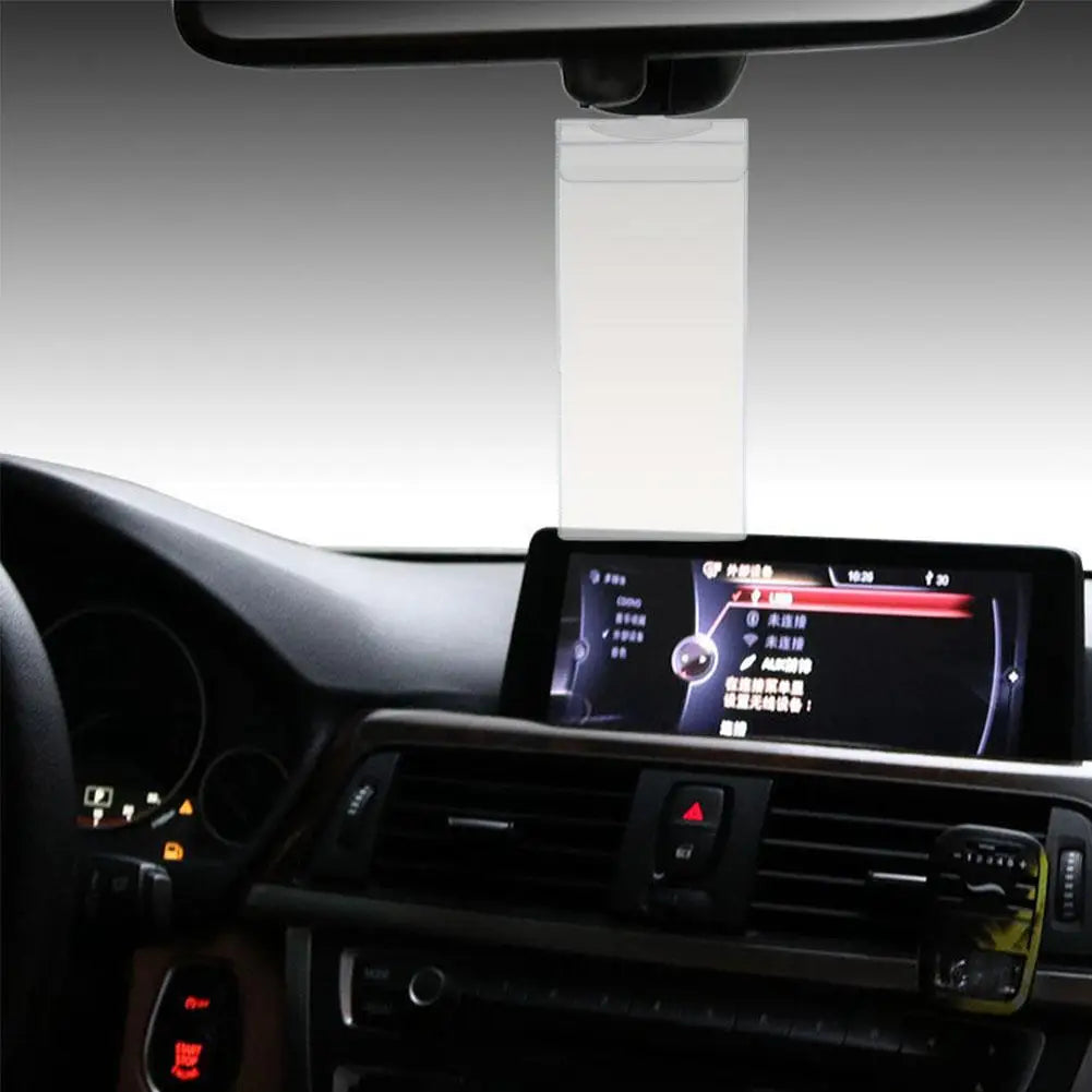 A parking permit holder and protector mounted on a car dashboard.
