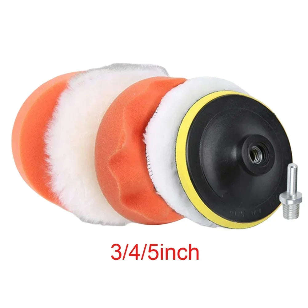 A set of orange and white car polishing pads with a black center and yellow rim.