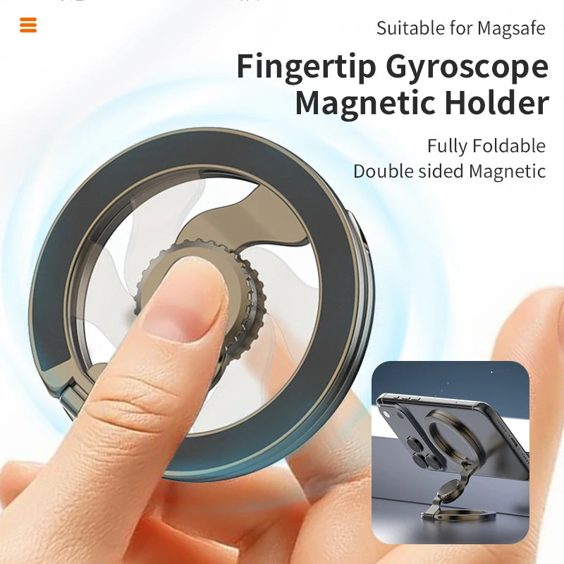 A hand holds a fully foldable, double-sided magnetic fingerprint gyroscope holder for a smartphone.