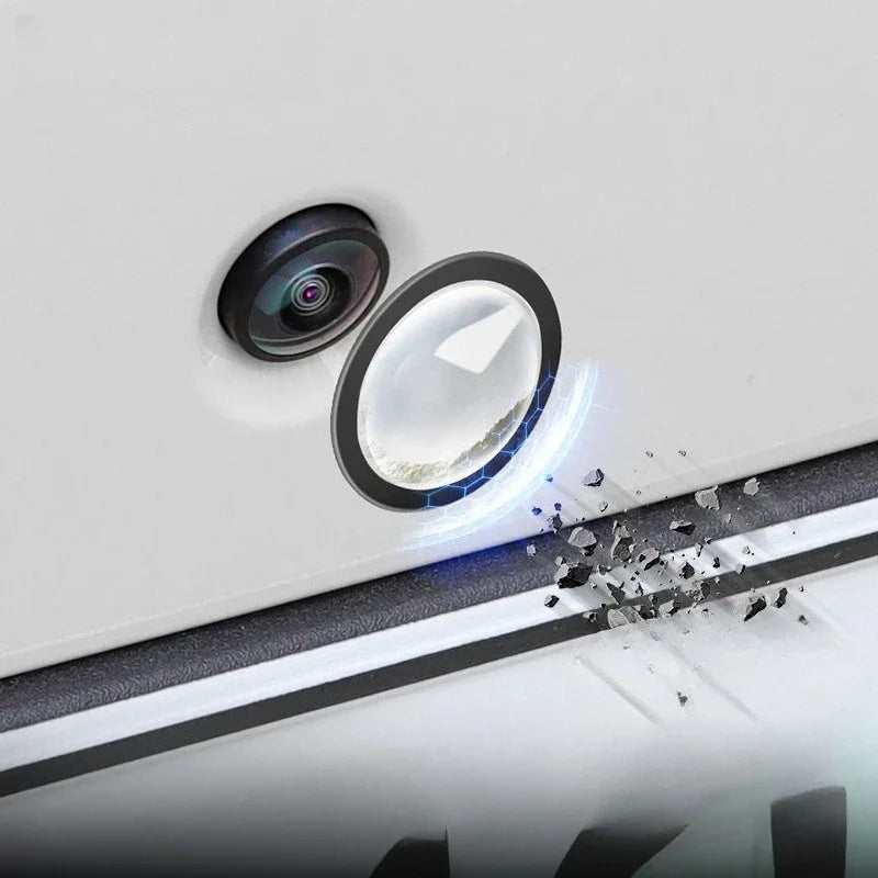 A close-up of a universal car camera protection film being applied to a windshield, showing the film and protective layer.
