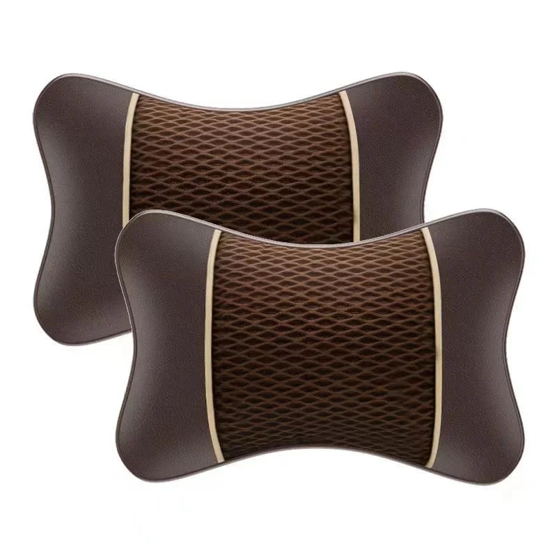 A pair of brown, quilted car headrest pillows designed for neck comfort.