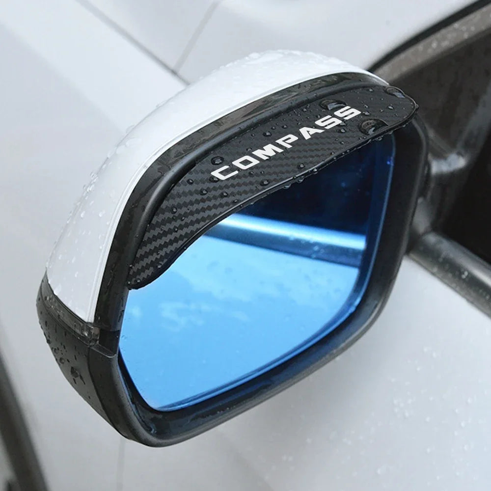 Close-up of a black and white carbon fiber texture rain visor for a rearview mirror.
