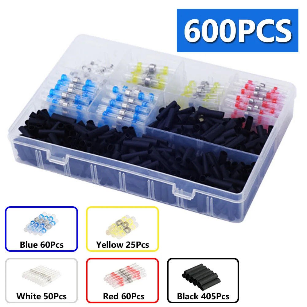 A clear plastic container holds various colored heat shrink wire terminals for electrical wiring projects.