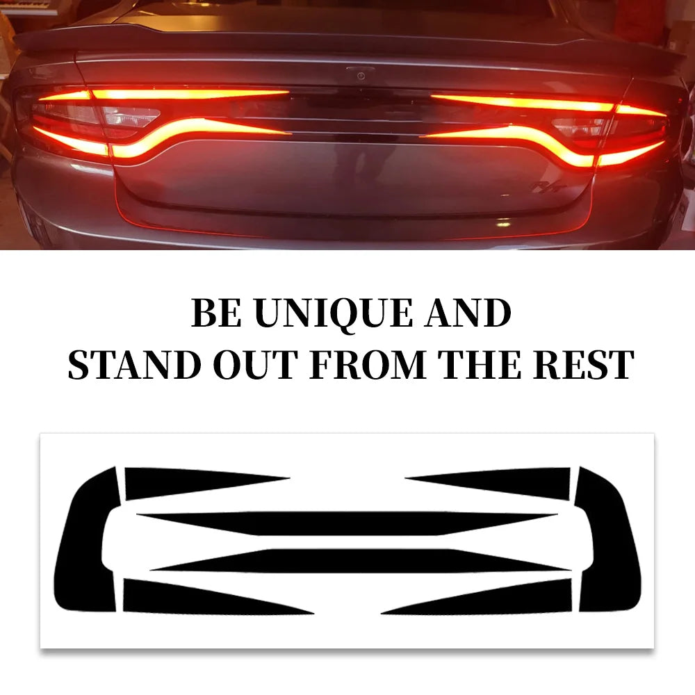 A close-up of a red Dodge Charger's taillight with a black decal applied.