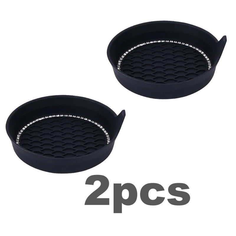 Two black rhinestone car cup holder coasters with a diamond pattern.