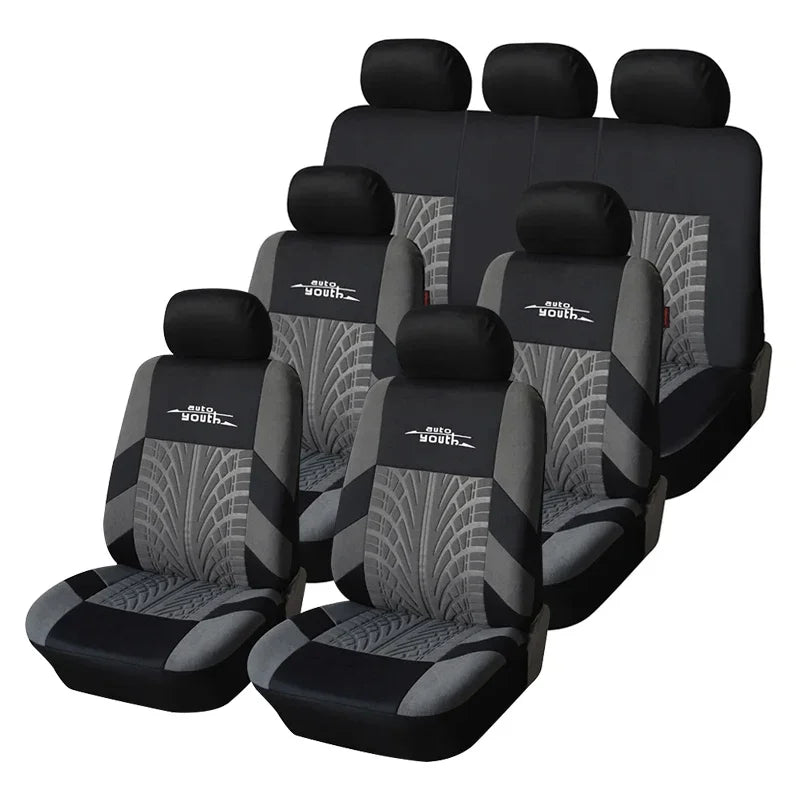 A set of black universal car seat covers with gray patterned fabric for multiple seats.