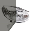 A clear automotive headlight assembly showing a tint film applied to the lens.