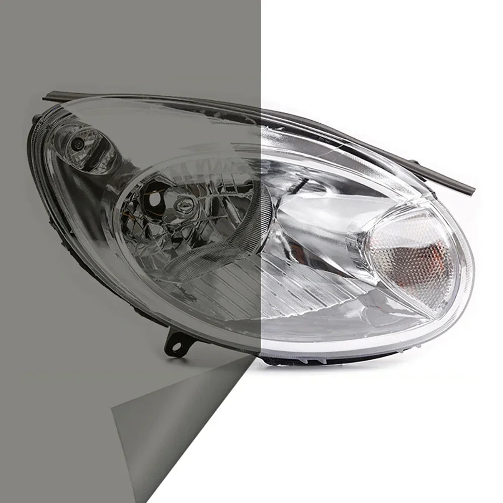 A clear automotive headlight assembly showing a tint film applied to the lens.