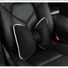Black ergonomic car headrest pillow with a bow design shown inside a car seat.
