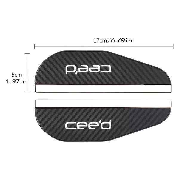 Black carbon fiber rain shield for car rearview mirror, measuring 17cm long.