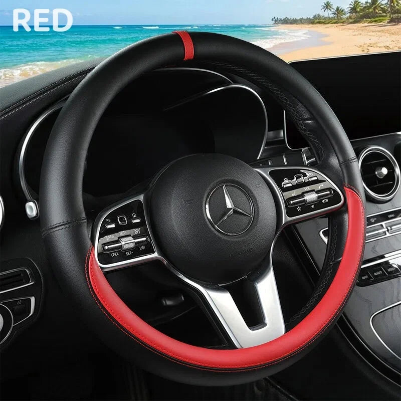 A black steering wheel with red stitching and a silver accent is shown inside a car cabin.