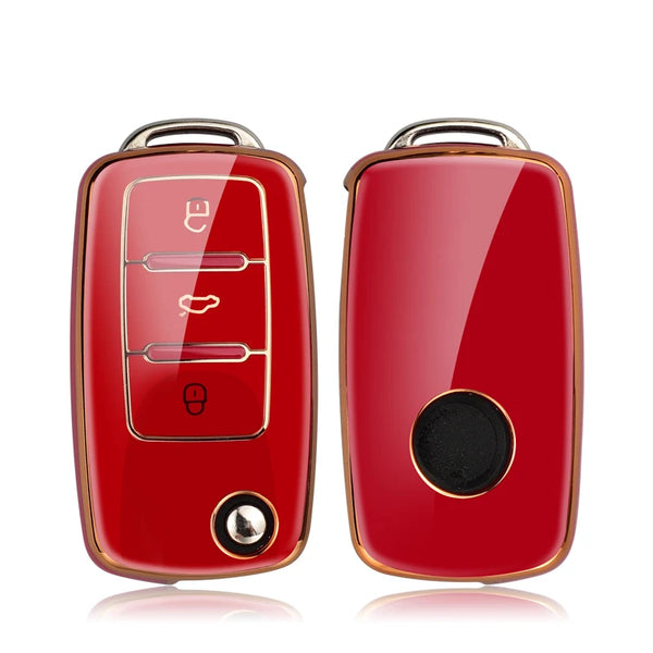 A pair of red TPU car key covers with metallic accents for Volkswagen, Skoda, and Seat vehicles.