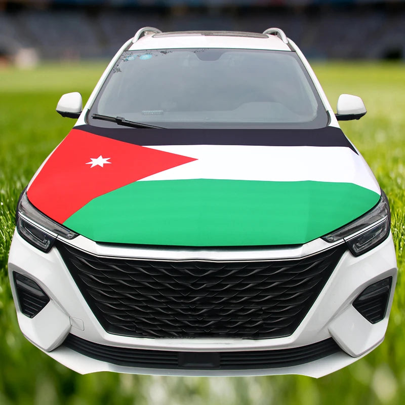 A white car with a flag featuring the Palestinian flag design on the hood.