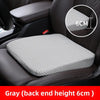 Gray honeycomb memory foam car seat booster cushion placed on a black car seat.