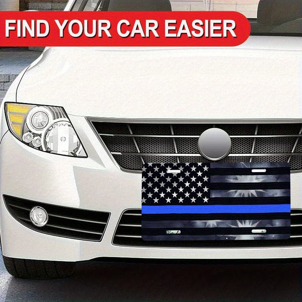 Primer plano de la parrilla frontal de un coche blanco con una señal decorativa de bandera de aluminio con diseño de la bande