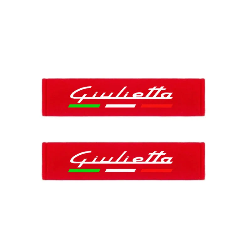 Two red shoulder cushions with the name Giulietta printed on them.