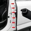 Close-up view of car door edge weatherstrip seal strips and related components on a white vehicle door frame.