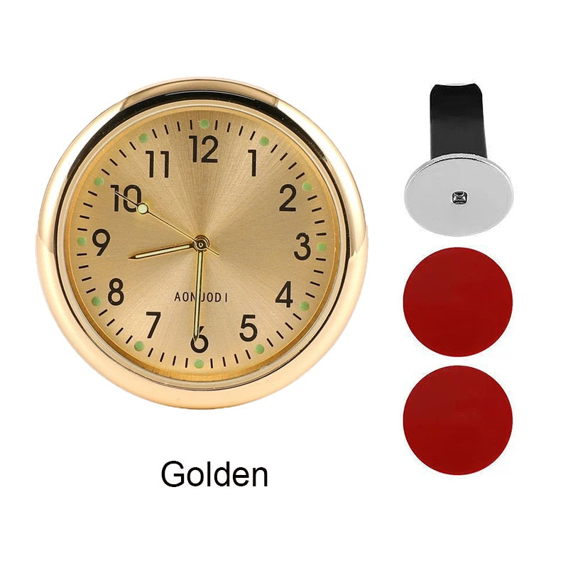 Golden round stick-on car clock with a black mounting clip and red buttons